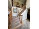 An elegant staircase with wooden railings leads to the upper level, enhancing the home's architectural charm and flow at 2246 Carrington Dr, Ellenwood, GA 30294