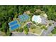 An aerial view of the community recreation area showing tennis courts, a pool, a playground, and a clubhouse at 3625 New River Ct, Cumming, GA 30040