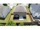 An aerial view of a backyard features a privacy fence, newly mulched bed, patio, and well maintained lawn at 3625 New River Ct, Cumming, GA 30040