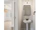Charming half-bathroom with pedestal sink and modern fixtures at 3625 New River Ct, Cumming, GA 30040