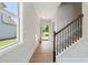 Welcoming foyer with hardwood floors and staircase at 3625 New River Ct, Cumming, GA 30040