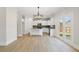 Bright kitchen area with an island, stainless appliances, and access to the backyard at 3625 New River Ct, Cumming, GA 30040