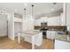 Bright kitchen with granite countertops, stainless appliances and island at 3625 New River Ct, Cumming, GA 30040