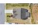 Aerial view of a home showing the roof, driveway, and landscaping at 5749 Creek Indian Dr, Sugar Hill, GA 30518