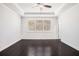 Bright bedroom featuring dark hardwood floors, recessed lighting, and crown molding at 5749 Creek Indian Dr, Sugar Hill, GA 30518
