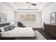 Modern bedroom with sleek furniture, stylish decor, and lots of natural light at 5749 Creek Indian Dr, Sugar Hill, GA 30518