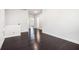 Spacious bonus room with hardwood floors and access to the bathroom at 5749 Creek Indian Dr, Sugar Hill, GA 30518