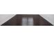 Close up shot of dark stained wood flooring at 5749 Creek Indian Dr, Sugar Hill, GA 30518