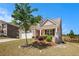 Charming home with well-manicured front yard and inviting entrance at 5749 Creek Indian Dr, Sugar Hill, GA 30518