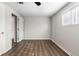 Bedroom featuring hardwood floors, fresh paint, large closet, and window at 60 Highland Dr, Stockbridge, GA 30281