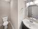 Powder room with a pedestal sink, octagonal mirror, and tile flooring at 6980 Roswell Rd # J6, Atlanta, GA 30328
