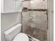 Renovated bathroom featuring a tiled shower and modern fixtures at 6980 Roswell Rd # J6, Atlanta, GA 30328