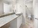 Bathroom featuring a granite countertop vanity with a vessel sink and a glass-enclosed shower at 6980 Roswell Rd # J6, Atlanta, GA 30328