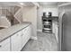 Modern kitchen featuring stainless steel appliances, granite countertops, and white cabinetry at 6980 Roswell Rd # J6, Atlanta, GA 30328