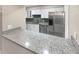 Renovated kitchen showcasing granite countertops, stainless steel appliances, and ample cabinet space at 6980 Roswell Rd # J6, Atlanta, GA 30328