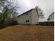 Backyard featuring a hillside and a wooden fence and deck for entertainment at 3413 Creekview Dr, Rex, GA 30273