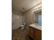 Bathroom featuring a vanity sink, toilet, and tiled shower with a neutral color palette at 3413 Creekview Dr, Rex, GA 30273