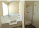 Bright bathroom with a large soaking tub and a separate shower stall at 3413 Creekview Dr, Rex, GA 30273