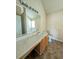Well-lit bathroom with a large mirror, vanity, and soaking tub at 3413 Creekview Dr, Rex, GA 30273