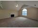Spacious living room with a fireplace, large window, and neutral carpeting at 3413 Creekview Dr, Rex, GA 30273