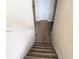 Carpeted stairs lead to an upper level, providing a smooth transition between floors at 3413 Creekview Dr, Rex, GA 30273