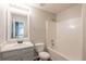 Cozy bathroom featuring a single sink vanity, toilet and a shower tub combination at 4205 Post Oak Grv, Atlanta, GA 30349