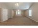 Large bonus room with recessed lighting and neutral carpeting, perfect for entertaining at 4205 Post Oak Grv, Atlanta, GA 30349