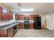 Well-designed kitchen with wooden cabinets, sleek appliances, and durable countertops at 4205 Post Oak Grv, Atlanta, GA 30349