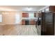 Spacious kitchen showcasing modern appliances, wood cabinets, and durable wood flooring at 4205 Post Oak Grv, Atlanta, GA 30349