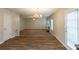 Bright living room featuring neutral tones, hardwood flooring, a decorative chandelier, and a cozy fireplace at 4205 Post Oak Grv, Atlanta, GA 30349