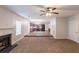 Open floor plan with carpeted living room and raised wood floor to kitchen at 4205 Post Oak Grv, Atlanta, GA 30349