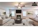Staged living room boasting plush furniture, a cozy fireplace, and large windows for natural light at 4205 Post Oak Grv, Atlanta, GA 30349