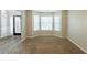 Open living room area features bay windows and neutral carpet at 4205 Post Oak Grv, Atlanta, GA 30349
