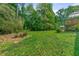 Spacious backyard with a wooden deck and patio at 546 Wagon Wheel Climb, Lawrenceville, GA 30044