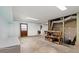 Unfinished basement with concrete floor, utility access, and walkout door to the exterior at 546 Wagon Wheel Climb, Lawrenceville, GA 30044