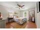 Cozy bedroom featuring a black metal bed, wooden floors, and soft lighting, creating a serene and relaxing atmosphere at 546 Wagon Wheel Climb, Lawrenceville, GA 30044