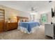 Spacious bedroom with a cozy bed, soft carpet, and natural light, creating a relaxing and comfortable retreat at 546 Wagon Wheel Climb, Lawrenceville, GA 30044