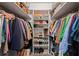 Walk-in closet providing ample storage with shelving and hanging space for organization at 546 Wagon Wheel Climb, Lawrenceville, GA 30044