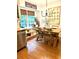 Cozy dining area filled with natural light, a rustic table, and stylish decor, adjacent to the kitchen at 546 Wagon Wheel Climb, Lawrenceville, GA 30044