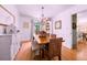 Comfortable dining room with hardwood floors and traditional furnishings at 546 Wagon Wheel Climb, Lawrenceville, GA 30044