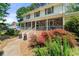 Charming two-story home featuring a stone facade, covered porch, and beautifully landscaped front yard at 546 Wagon Wheel Climb, Lawrenceville, GA 30044