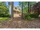 Exterior view of a brick front home with mature trees and landscaping at 546 Wagon Wheel Climb, Lawrenceville, GA 30044