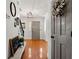 Inviting foyer with hardwood floors, decorative wreath, and gray front door at 546 Wagon Wheel Climb, Lawrenceville, GA 30044