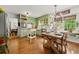 Charming kitchen with green cabinetry, stainless steel appliances, and a breakfast area at 546 Wagon Wheel Climb, Lawrenceville, GA 30044