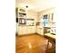 Bright kitchen features hardwood floors, tile backsplash, and stainless steel appliances at 546 Wagon Wheel Climb, Lawrenceville, GA 30044