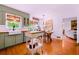 Cozy eat-in kitchen features a modern island, plenty of natural light, and wood floors at 546 Wagon Wheel Climb, Lawrenceville, GA 30044