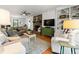 Cozy living room with stone fireplace, hardwood floors and built-in shelving at 546 Wagon Wheel Climb, Lawrenceville, GA 30044