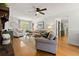 Open-concept living room with fireplace and lots of natural light at 546 Wagon Wheel Climb, Lawrenceville, GA 30044