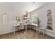 Bright home office with a sewing machine and a large work surface by a sunny window at 546 Wagon Wheel Climb, Lawrenceville, GA 30044