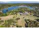 Scenic aerial view of a lakeside community featuring a golf course and swimming pool at 6095 Wayfarer Dr, Villa Rica, GA 30180